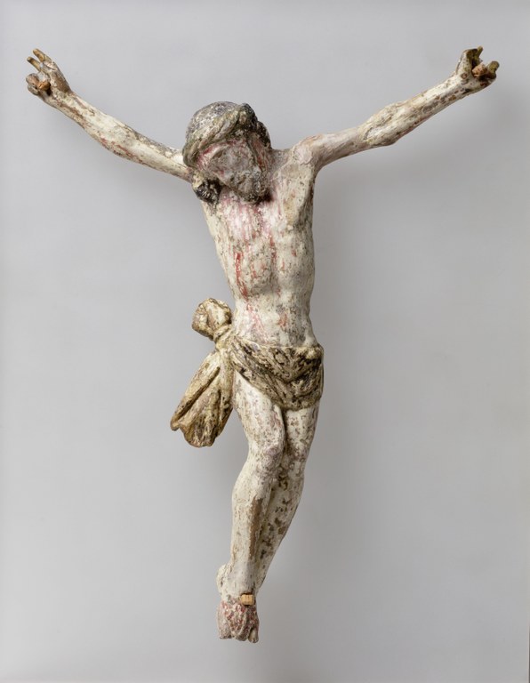 Kleines Kruzifix aus Marburg. Leidender Christus mit dem Haupt auf die Schulter geneigt und durch Farbe Blut am Körper markiert.