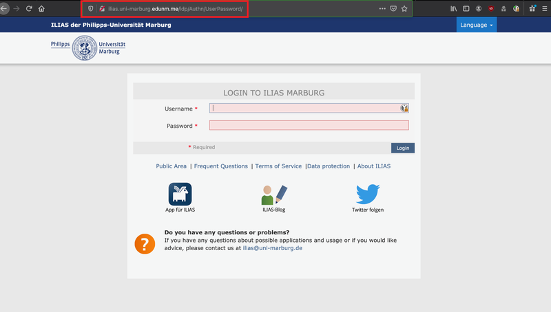 Screenshot einer gefälschten Login-Seite für ILIAS der Philipps-Universität Marburg. Die URL im Browser lautet: ilias.uni-marburg.edunm.me/idp/Authn/UserPassword/ und hebt damit die Domain "edunm.me" hervor, die nicht zur offiziellen Universität gehört. Auf der Seite werden Benutzername und Passwort abgefragt. Das Layout und Logo imitieren eine echte Universitätsseite und es gibt Links zu "Public Area", "Frequent Questions", "Terms of Service", "Data protection" und "About ILIAS" sowie Icons für App, Blog und Twitter. Im unteren Bereich findet sich eine Kontaktmöglichkeit an ilias@uni-marburg.de.