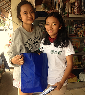 girls holding eco friendly bag