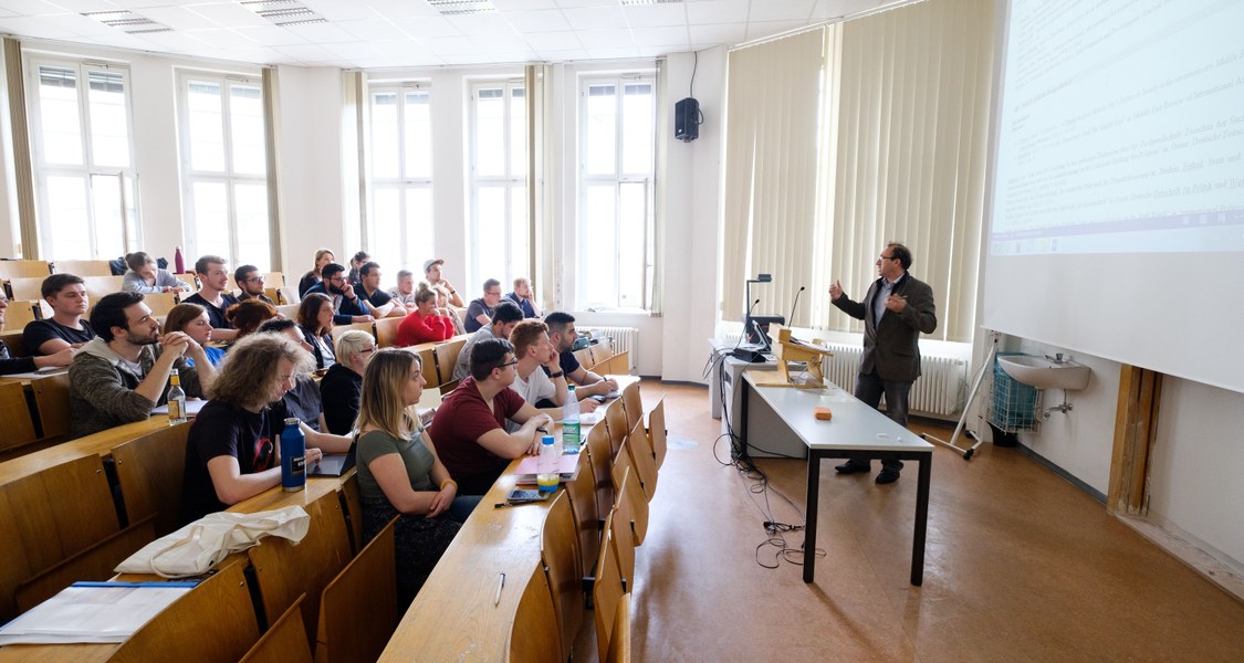 Lecturer and students in lecture hall