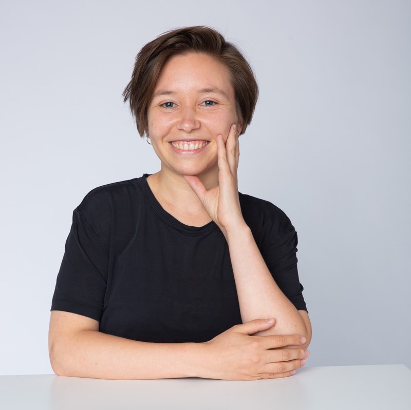 A picture of Pauline Junjinger. She is smiling into the camera and wearing a black shirt.