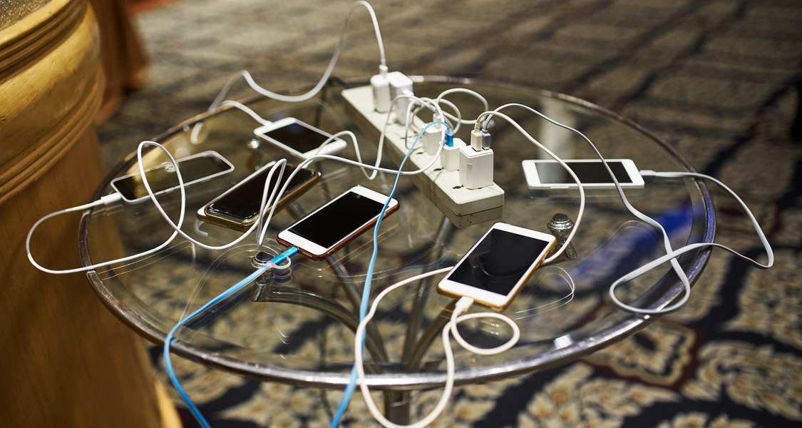 Several Smartphones on a Table.