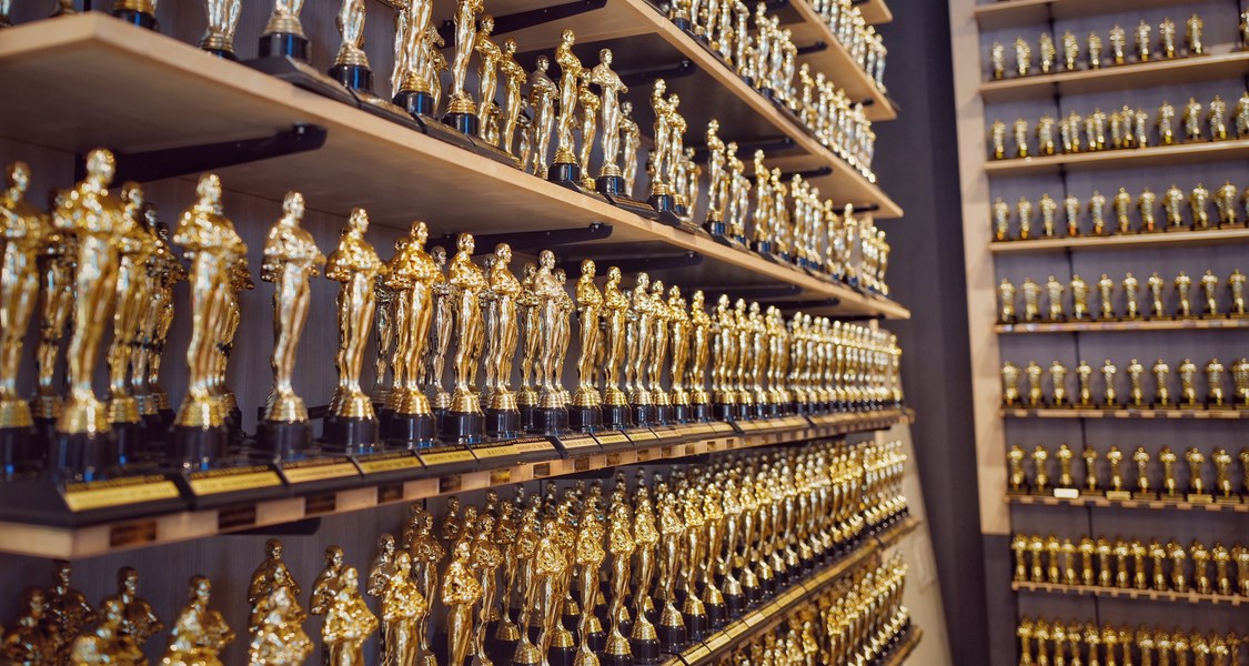 A room filled with shelves of identical human-shaped trophies. (Kind of like the Oscars)