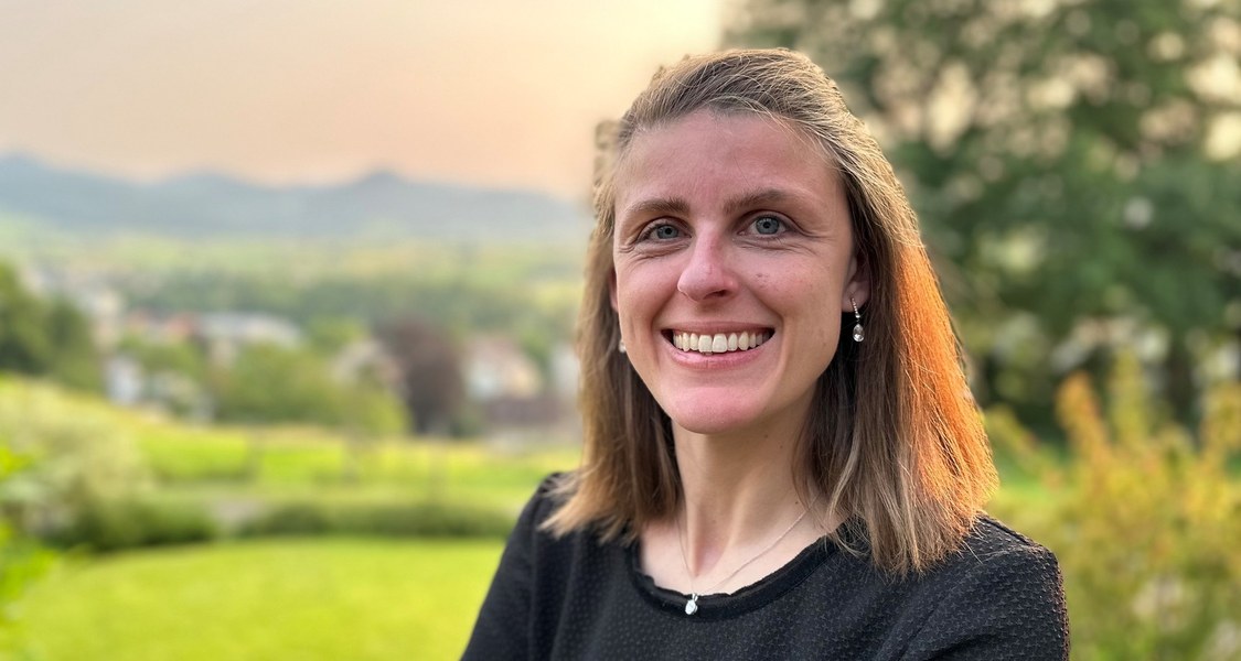 Foto of Nadine Leisgang in front of an evening landscape