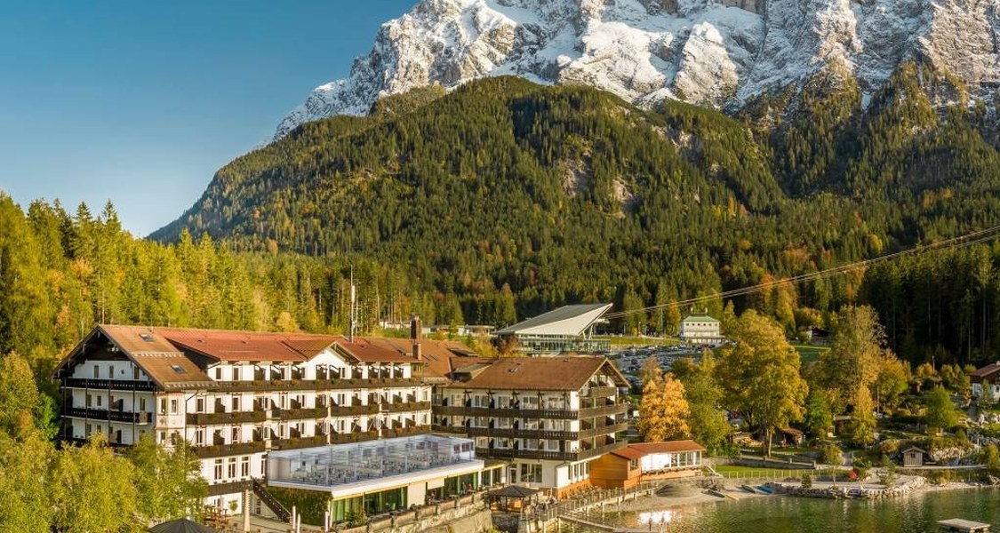A view overlooking the Eibsee hotel and the mountains on the background