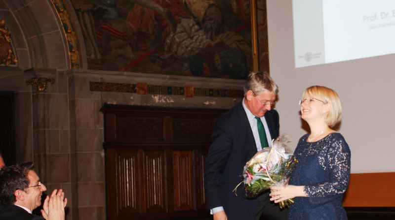 Professor Dr. Christoph Safferling (at the left) welcoming his successor Professor Dr. Stefanie Bock (at the right), and Professor Dr. Eckart Conze (in the middle).