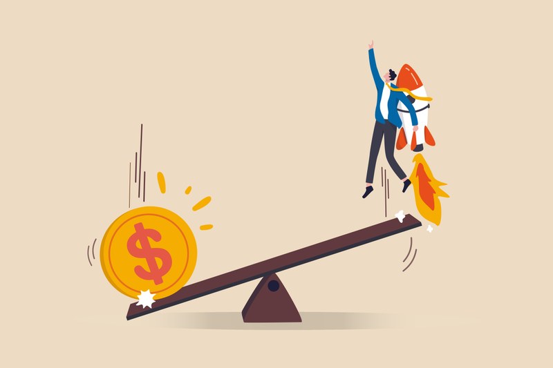 This is a comic illustration. In the center you can see a wooden seesaw. A large dollar coin falls onto the left part of the seesaw. Accordingly, the left part of the seesaw is pointing downwards. On the right part of the seesaw, which is tilted upwards, is a cartoon character reaching up towards the sky. It is carrying a rocket on its back and is about to take off.