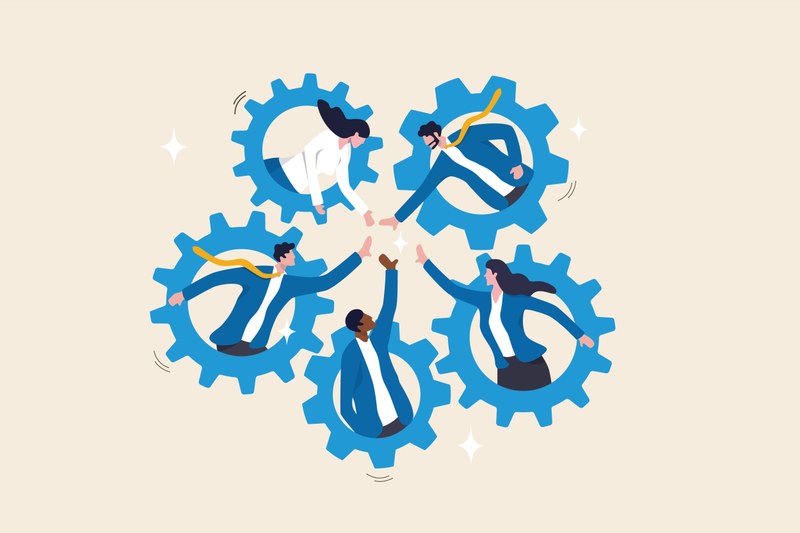 It is a comic-like illustration. There are 5 cogwheels arranged in a circle. A cartoon character is looking out from the center of each cogwheel with its upper body. All the cartoon characters have one hand stretched out towards the center. The hands are almost touching.