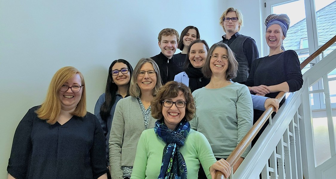MARA team members on stairs smiling