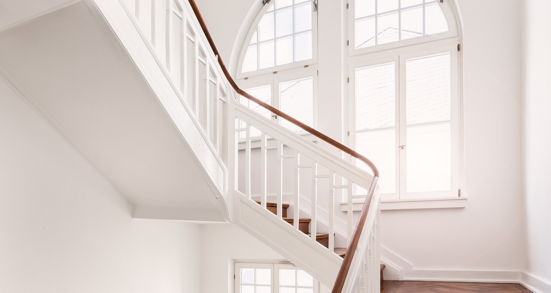 White stairway with a window