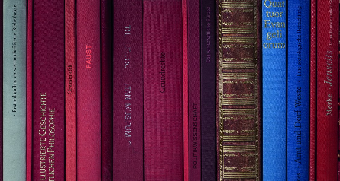 Back of several classical books in different colors