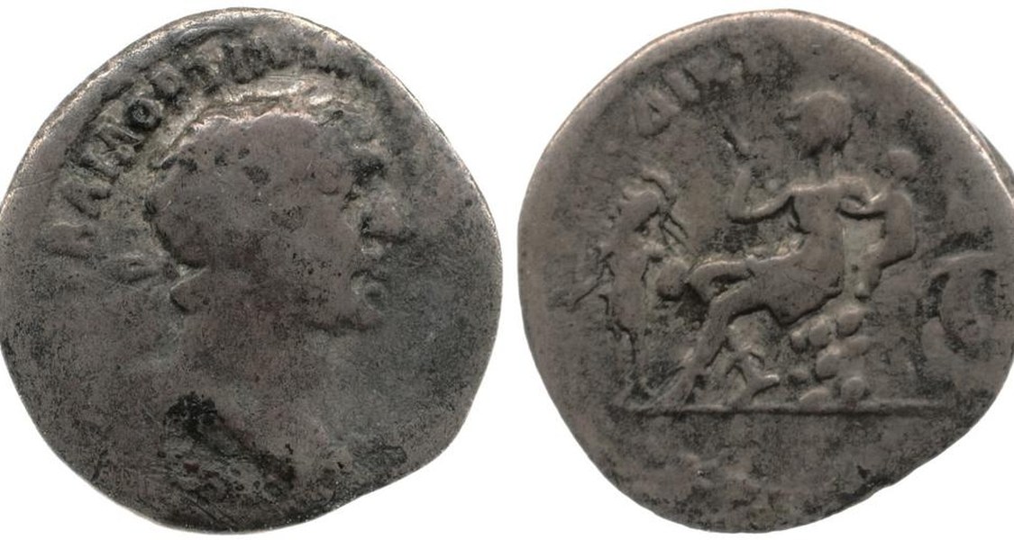 A coin with the head of Trajan on one side and a depiction of the goddess Diktynna on the other side