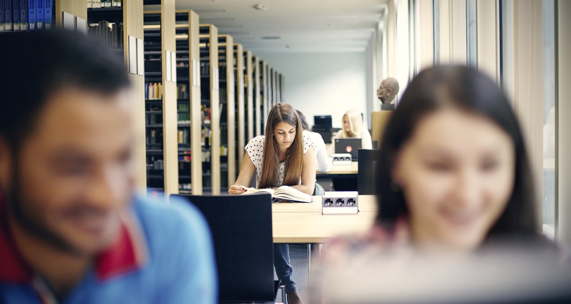 Students researching in a library.