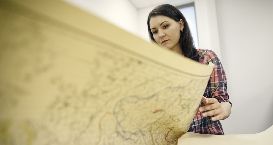 A Student looks at a linguistic map