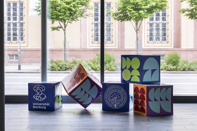 Colorful cardboard cubes in our new corporate design